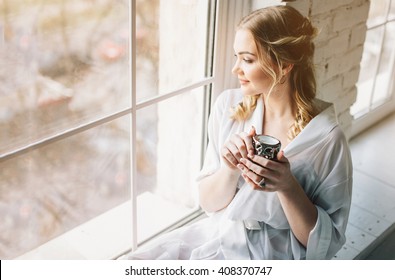 woman near window.Dream and relax