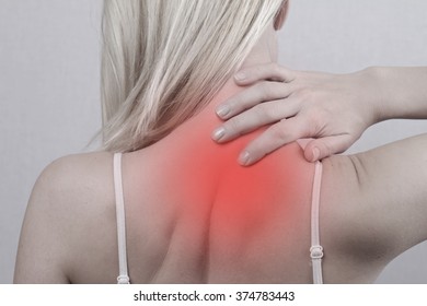 Woman With Neck And Back Pain. Woman Rubbing His Painful Back Close Up. Pain Relief,  Chiropractic Concept