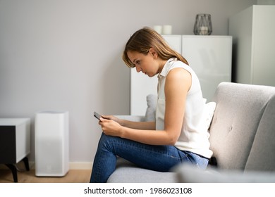 Woman With Neck Pain Sitting Using Mobile Phone