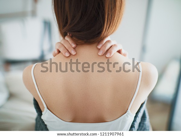 Woman with neck pain, stiff\
neck