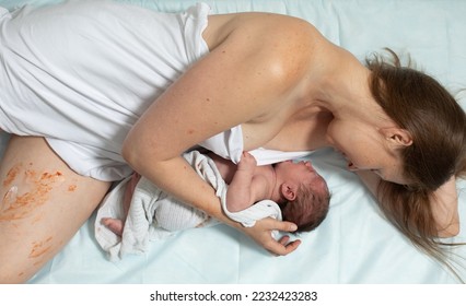 Woman with new born baby have a rest - Shutterstock ID 2232423283