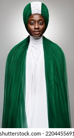 Woman In Nigerian Flag Green White Dress And Headwrap. Nigeria Independence Day. Model In Fashion African Turban Over Gray. Muslim Women Wearing Green Headscarf Drape