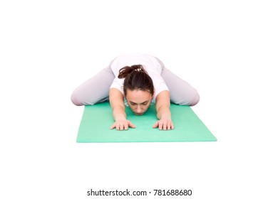 Woman With No Makeup Doing Yoga On A Green Yoga Mat Isolated On White Background