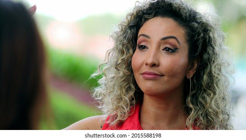 Woman Nodding Yes In Affirmation While Talking To Friend.