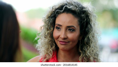 Woman Nodding Yes In Affirmation While Talking To Friend.