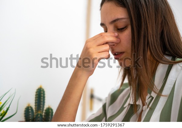 Woman\
with a nose pain. Sinusitis concept. Broken\
nose.