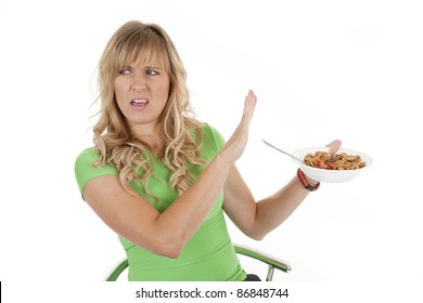 A Woman Not Happy And Not Wanting The Bowl Of Cereal In Her Hands.