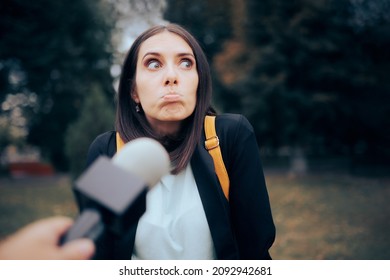 
Woman Not Knowing the Answer to Street Interviewer Question. Woman being interviewed by a reporter in vox pop video format
 - Shutterstock ID 2092942681