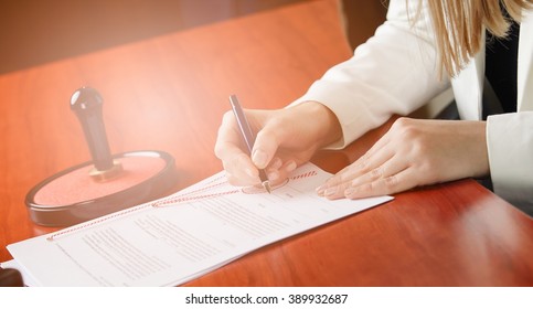 Woman Notary Public Signing The Contract In Her Office. Law Office