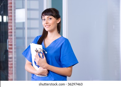 Woman Nurse with chart in modern hospital