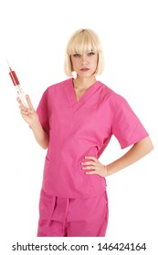 A Woman Nurse Holding On To A Red Needle Filled With Blood With A Mean Expression On Her Face.