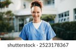 Woman, nurse or outdoor for portrait with smile, confidence or elderly care at nursing home. Caregiver, happy or healthcare professional at entrance for welcome, friendly service or career in Brazil