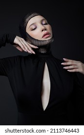 Woman With Nylon Stocking Mesh On Head. Black Mesh Bandage On Face Woman In Black Dress With A Low Neckline