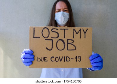 Woman Office Worker In Blue Shirt With Cardboard Sign LOST JOB. Jobless, Unemployment Due Covid-19 Concept. Asking For Money