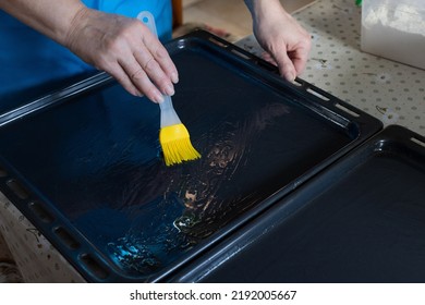 Woman Oiling Baking Sheet. Baking At Home.