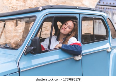 Woman Old Fashioned Car At Town