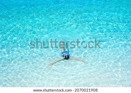 the woman on the beach, clear water sea with blue sky on the Holiday, swim on the turquoise water beach, at koh nang yuan island beach, koh tao ,suratthani , thailand