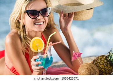 Woman On The Beach Drinks Coktail