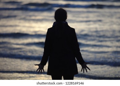 Woman On Beach In Early Morning Sun On Lido Beach In Venice 