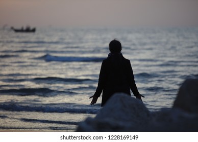 Woman On Beach In Early Morning Sun On Lido Beach In Venice 