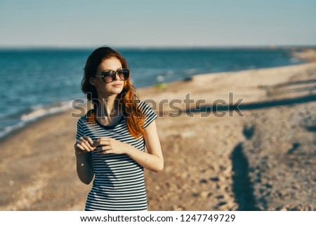 Woman on the beach near the ocean                         