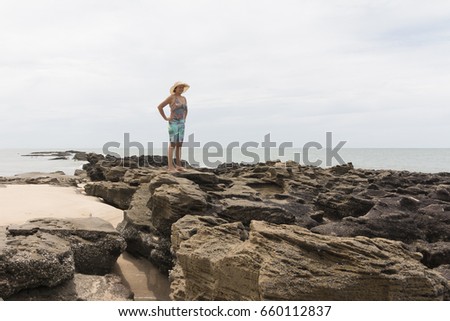 Woman on the beach in a rainy morning.
North coastline, Rio Grande do Norte, Brazil.
