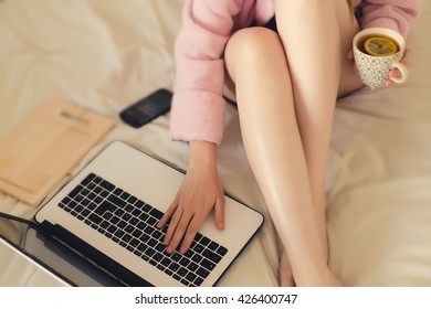 Woman On The Bed With Laptop, Smart Phone And Tea