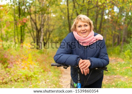 Similar – Smiling senior woman in wheelchair