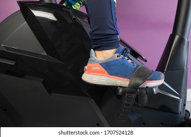 Woman On A Bike Cycling And Doing Exercise