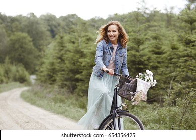 Woman On Bike In Forest 