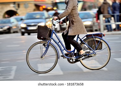 Woman On Bike In Profile