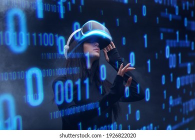 Woman on dark virtual reality background. Female using VR helmet. Augmented reality, future technology, game concept. Blue neon light. Futuristic holographic interface to display data.