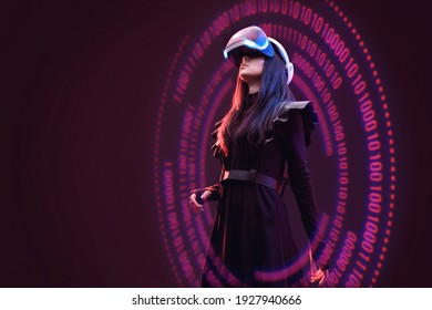 Woman on dark virtual reality background. Female using VR helmet. Augmented reality, future technology, game concept. Purple neon light. Futuristic holographic interface to display data.