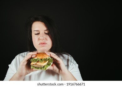 Woman On Diet Can't Resist Craving To Eat Tasty Hamburger. Food Addiction, Diet Breakdown, Compulsive Overeating Concept