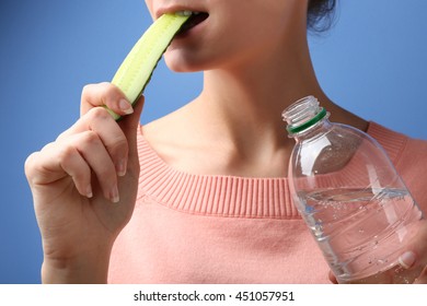 Woman On Diet With Water And Cucumber