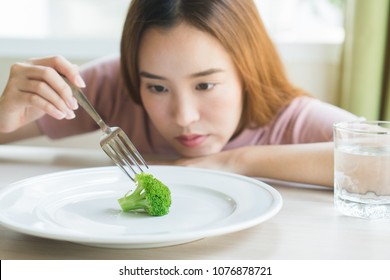 Woman On Dieting. Depressed Teen Looking At Her Empty Plate Dinner.