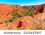 woman on the edge of Kings Canyon in Watarrka National Park, Australia