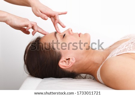 Similar – Young blond woman receiving a head massage