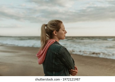 Woman on a gloomy beach