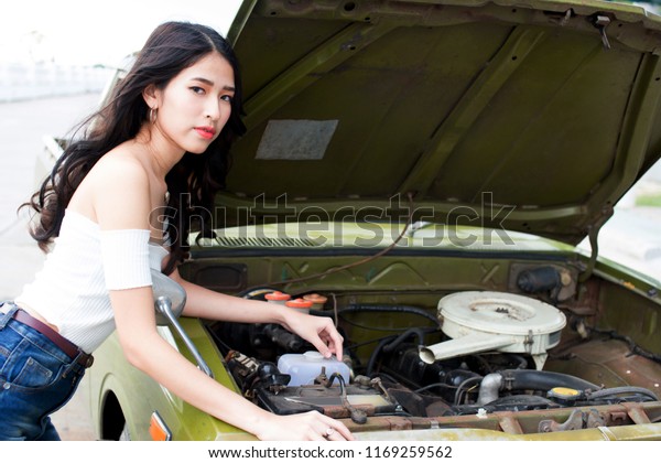 Woman on having a problem\
with car