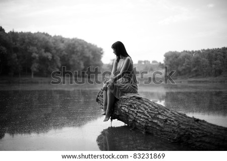 Similar – beautiful brunette short hair girl leaning on gray rock wall outdoors smiling happy