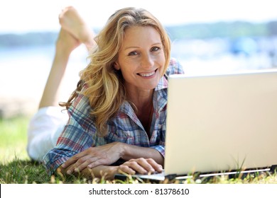 Woman On Laptop Outside