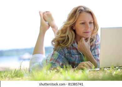 Woman On Laptop Outside