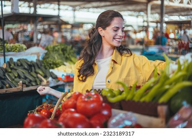 Woman on the market. Mature Female Customer Shopping At Farmers Market Stall. Woman shopping at the local Farmers market. Beautiful woman buying vegetables. - Powered by Shutterstock