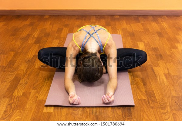 Woman On Mat Butterfly Pose Forehead Stock Photo (Edit Now ...