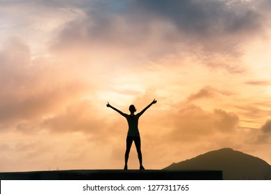 Woman on a mountain with thumbs up feeling motivated and happy.   - Shutterstock ID 1277311765