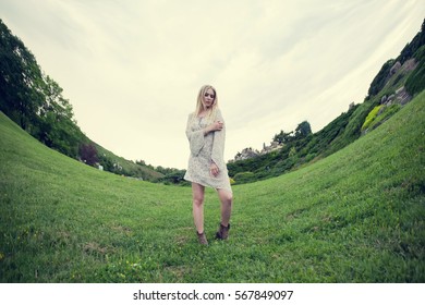 Woman On Nature In An Abstract World. Girl Stands On The Horizon Arched - Fish Eye Effect.