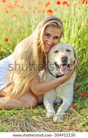 Similar – Pretty blond woman with her two dogs