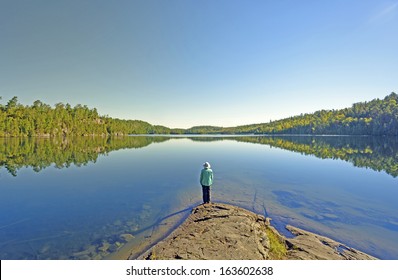 Woman On Ottertrack Lake In The Boundary Waters