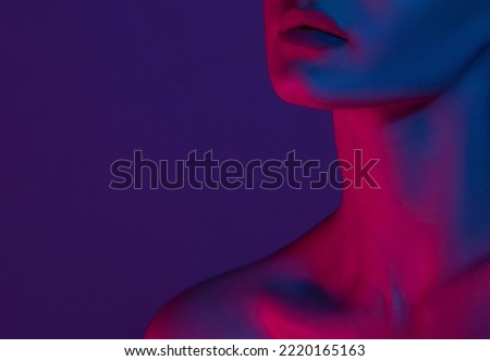 Woman on pink blue neon background.. Anonymous beauty portrait.